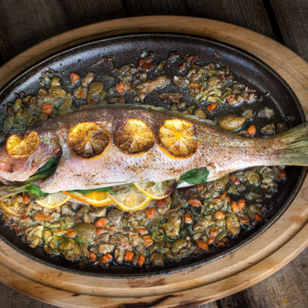 Oven-baked and stuffed with flavor, this fish is fall-off-the-bone delicious. (All photos credit: George Graham)