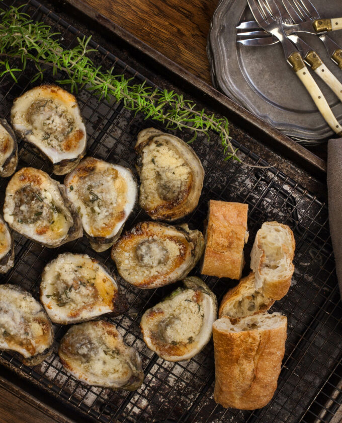 Buttery, garlicky, and cheesy--Louisiana oysters on the half shell are delicious right off the grill. (Photo credit: George Graham)