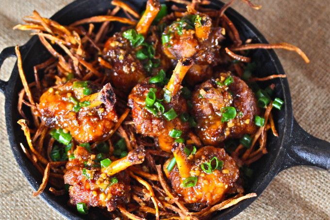 Cajun Glazed Chicken Lollipops on Sweet Potato Hay