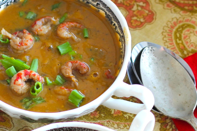 Bowl of Crawfish and Pumpkin Bisque with Caribbean and Cajun recipe ingredients.