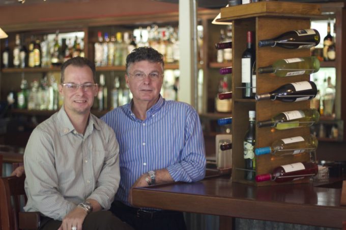 Co-owners Christopher Thames (left) and Leon Steele (right) at the Grand Coteau Bistro bar.
