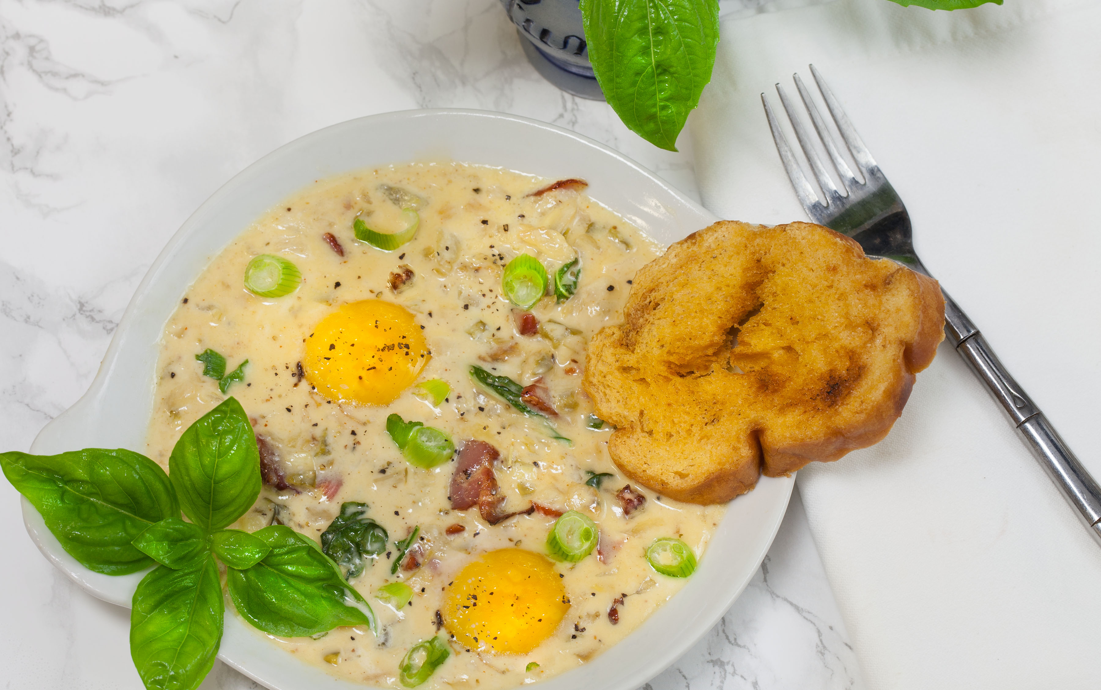 Baked Eggs in Tasso Cream features Savoie’s Smoked Tasso-image