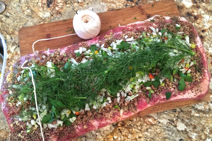 Stuffing my Pork Belly Porchetta Stuffed with tasty ingredients, this Cajun recipe for Pork Belly Porchetta is ready to be rolled.