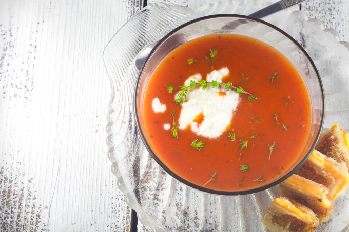 Tomato Soup with Grilled Cheese Croutons is a subtle Cajun recipe using ripe tomatoes.