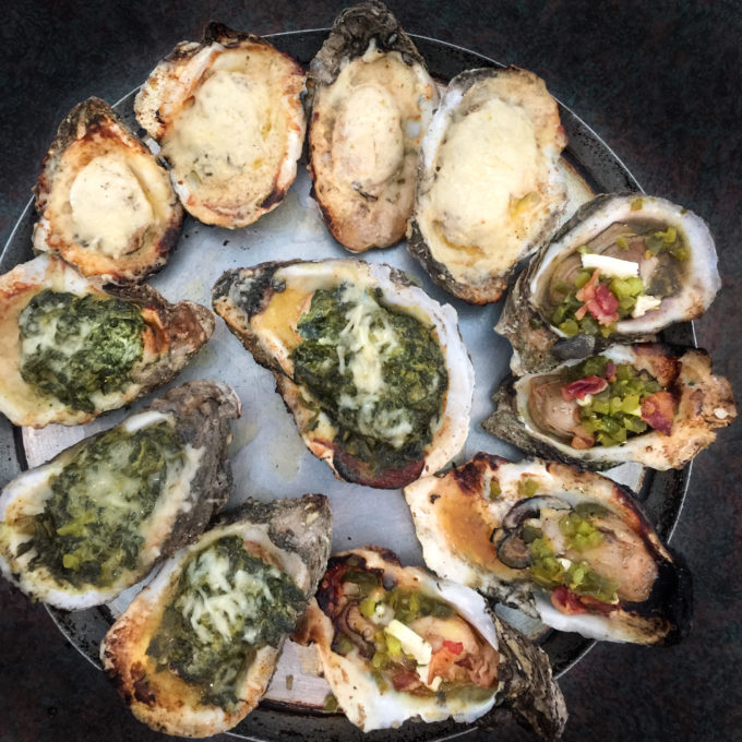 Clockwise from top: Shuck-a-fella, Roughneck, and Rockefeller oysters share the plate.