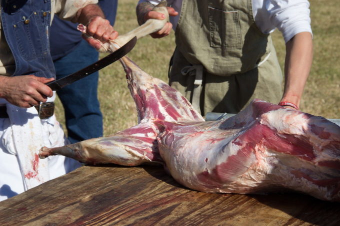 Boucherie-master Toby Rodriquez butchers a lamb at the annual Runaway Boucherie.