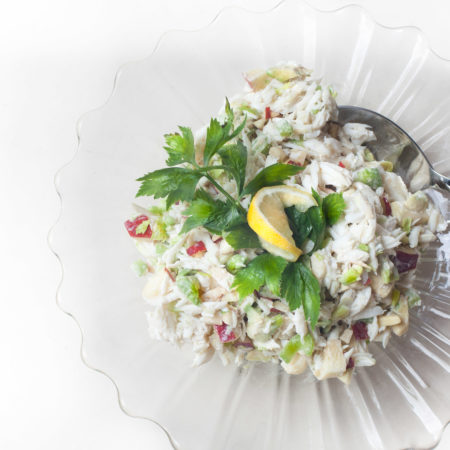Lumps of white crabmeat fresh from Gulf waters are treated lightly in this classic salad combination. (Photo credit: George Graham)