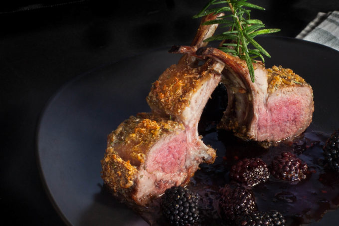 With its perfect pink center and cracklin' crust, lamb chops stand in a pool of blackberry wine-infused sauce. (All photos credit: George Graham)