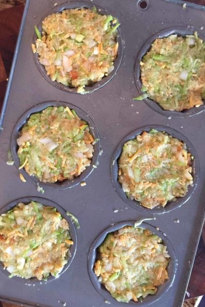 Ready for the oven! Raw ingredients are filled and tightly compressed in a muffin pan.