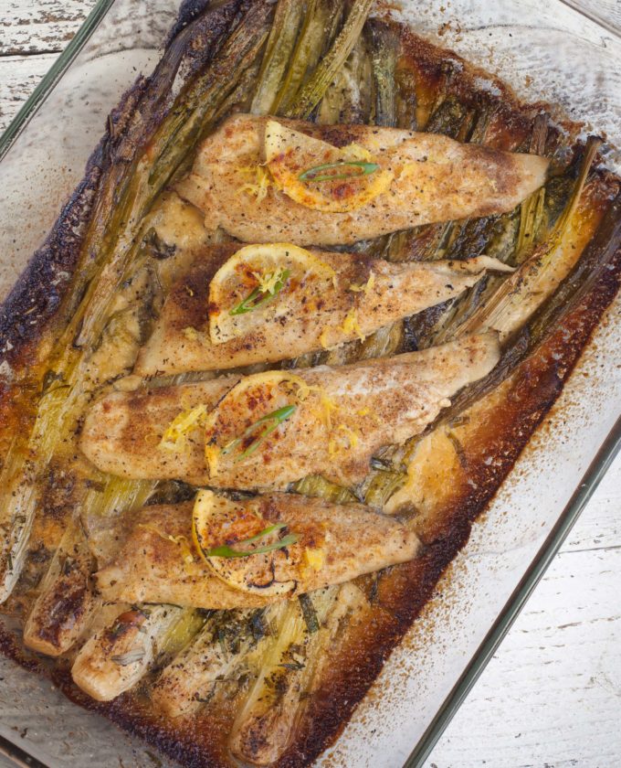 Baked Flounder with Spring Onion Gratin overhead Spring onions are the springboard for the creamy herbs that elevate this Baked Flounder with Spring Onion Gratin to new heights.