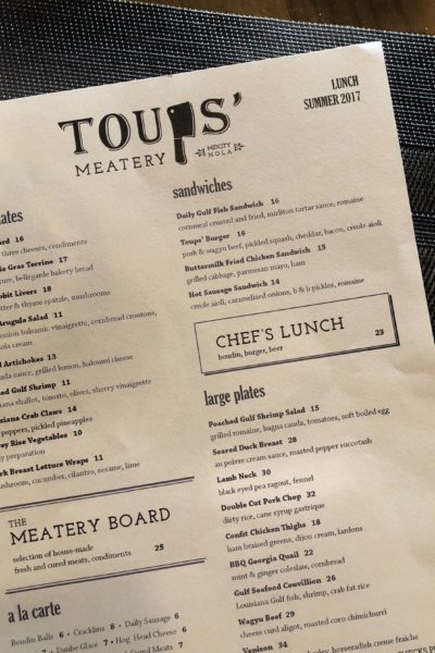 Toups' Meatery menu Lamb Neck is featured on Toups' Meatery lunch and dinner menu at their Mid-City location in New Orleans.