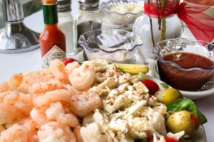 A cold glass of white wine is the perfect pairing for this classic seafood salad.