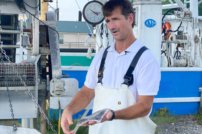 Douglas Olander tells how he brings black drum from boat to table. (Photo credit: Roxanne Graham)