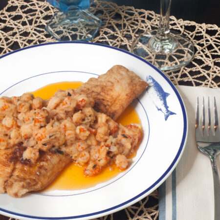 Black Drum with crispy fish fillets in a butter lemon sauce studded with crawfish tails is a Cajun recipe with an elegant Creole flair. (Photo credit: George Graham)