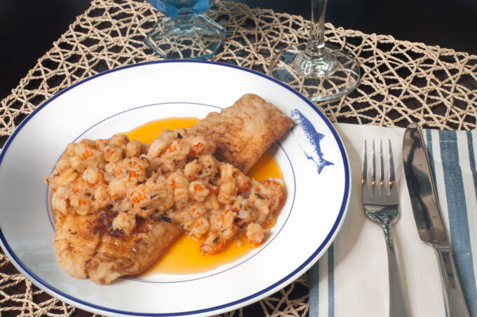 Black Drum with crispy fish fillets in a butter lemon sauce studded with crawfish tails is a Cajun recipe with an elegant Creole flair. (Photo credit: George Graham)